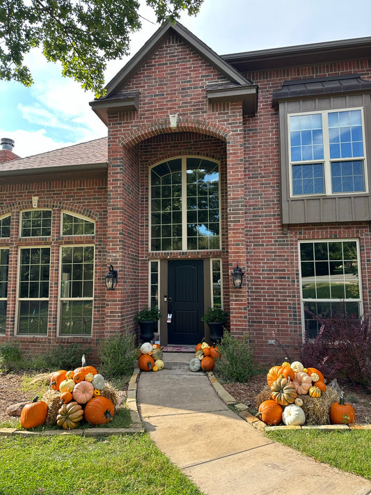 Brick house with decorative pumpkins in front yard located Julington Creek FL